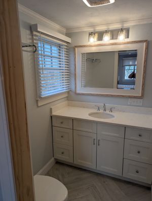 Luxury bathroom renovation with double vanity and walk-in shower