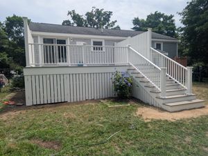 Outdoor deck addition with railing